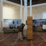 Visitors at the Vorarlberg sustainable architecture exhibition, Palais de la Porte Dorée, Paris, 2003 © ARR