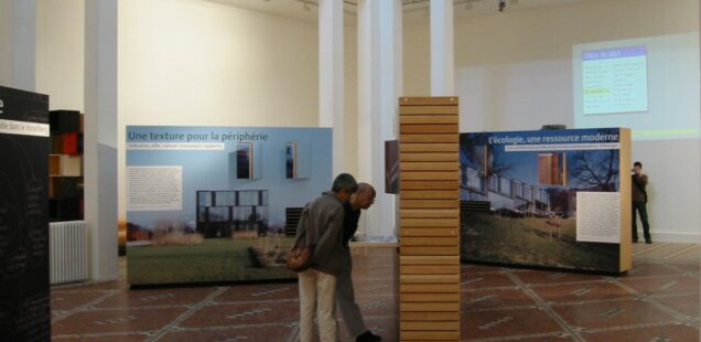 Visitors at the Vorarlberg sustainable architecture exhibition, Palais de la Porte Dorée, Paris, 2003 © ARR